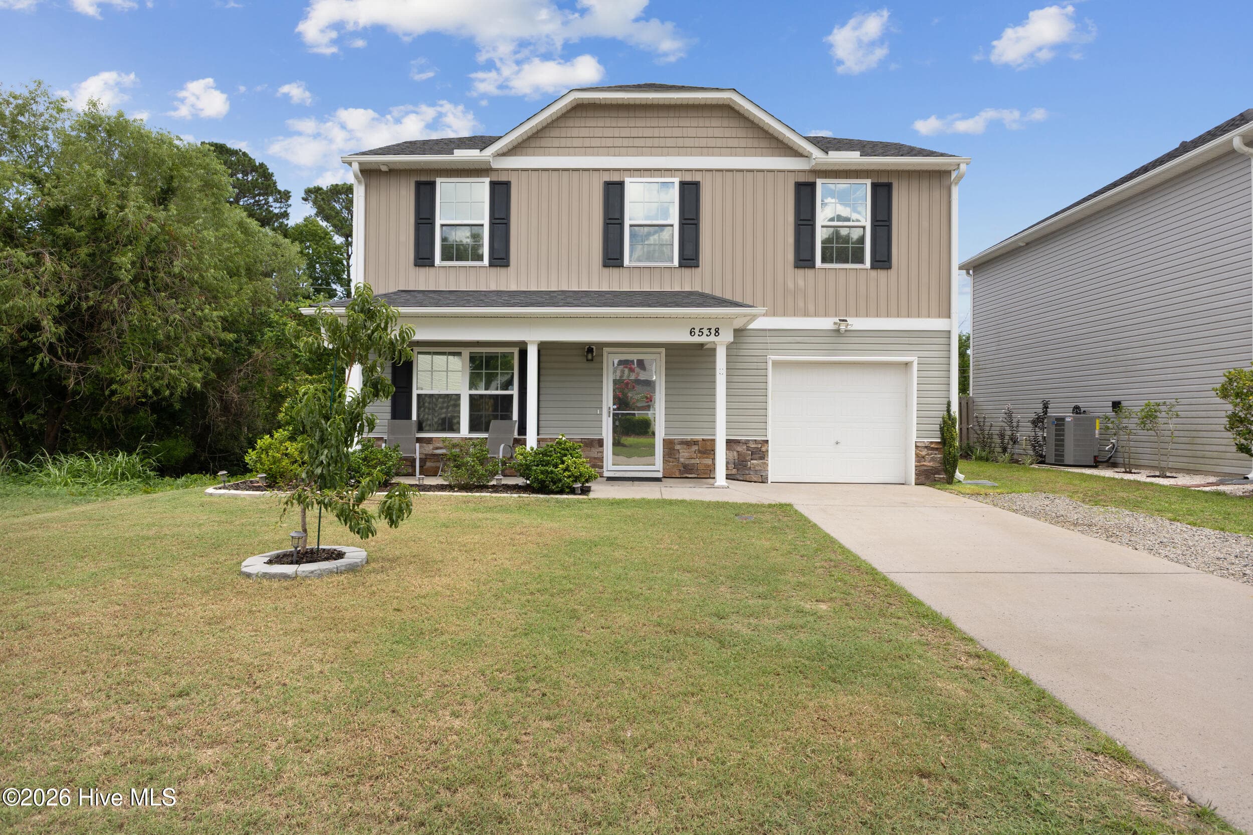 Front of 6538 Rustling Leaves Way, Wilmington, NC 28409