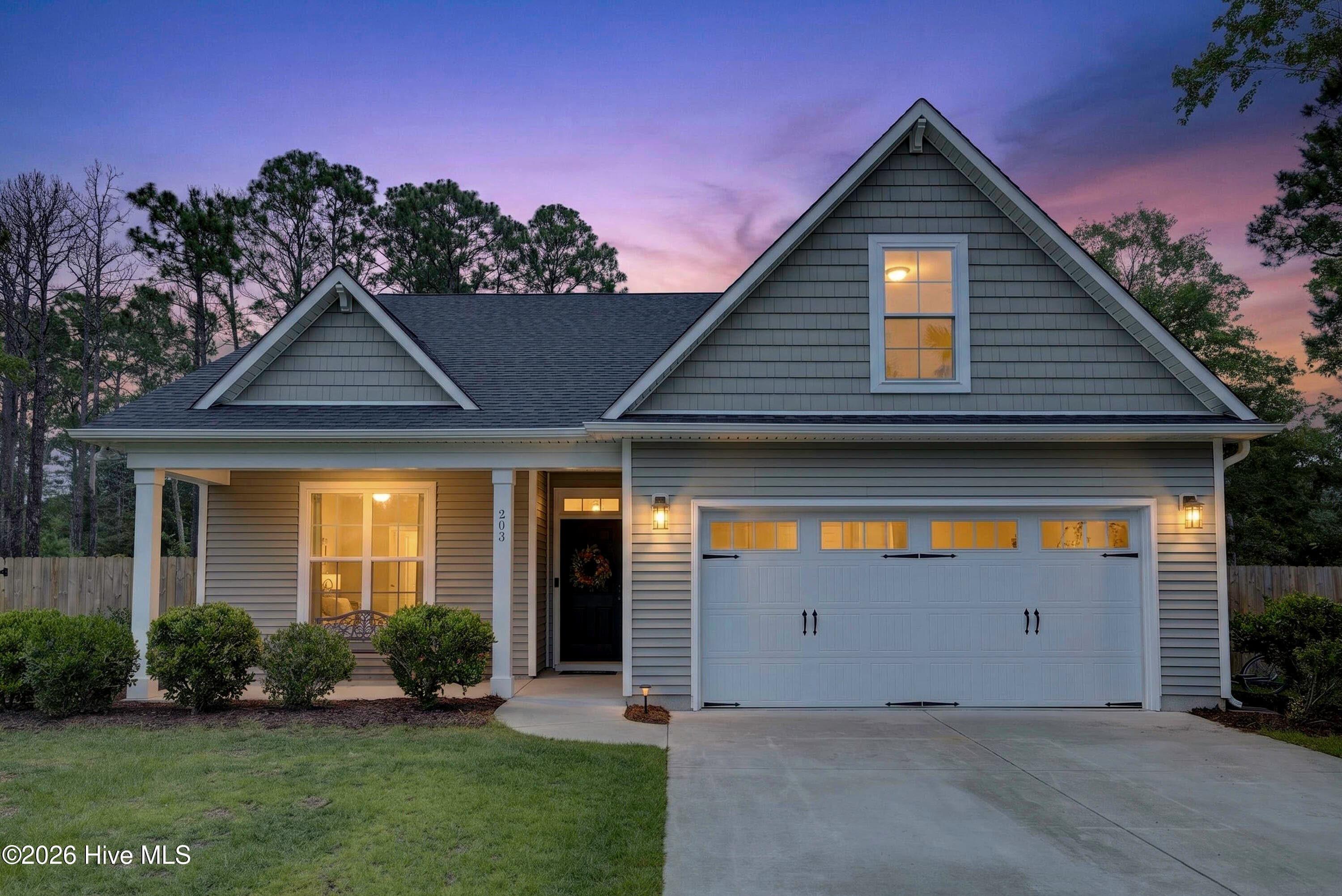 Front of 203 E Frampton Court, Hampstead, NC 28443