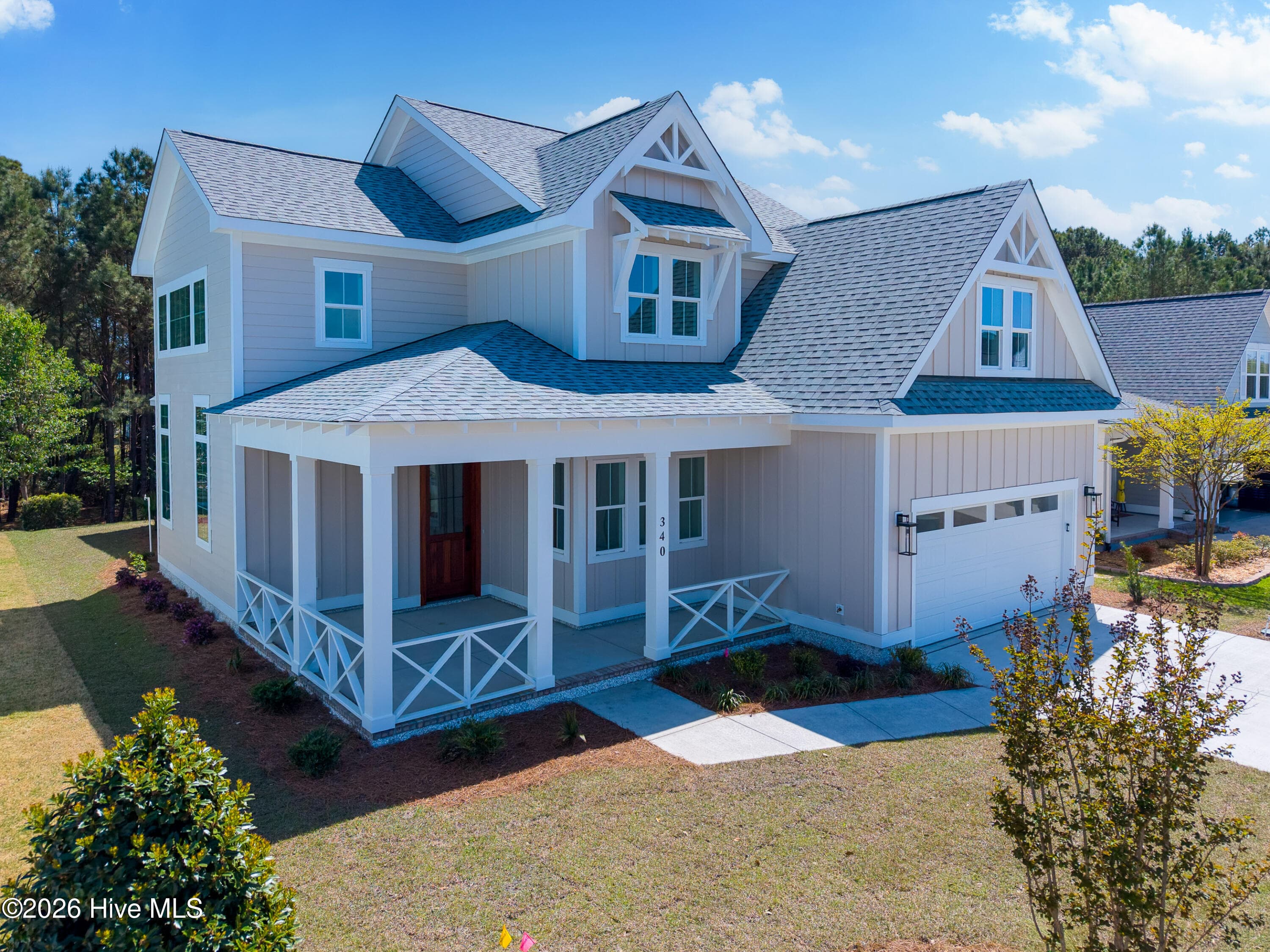 Front of 340 Spicer Lake Drive, Holly Ridge, NC 28445
