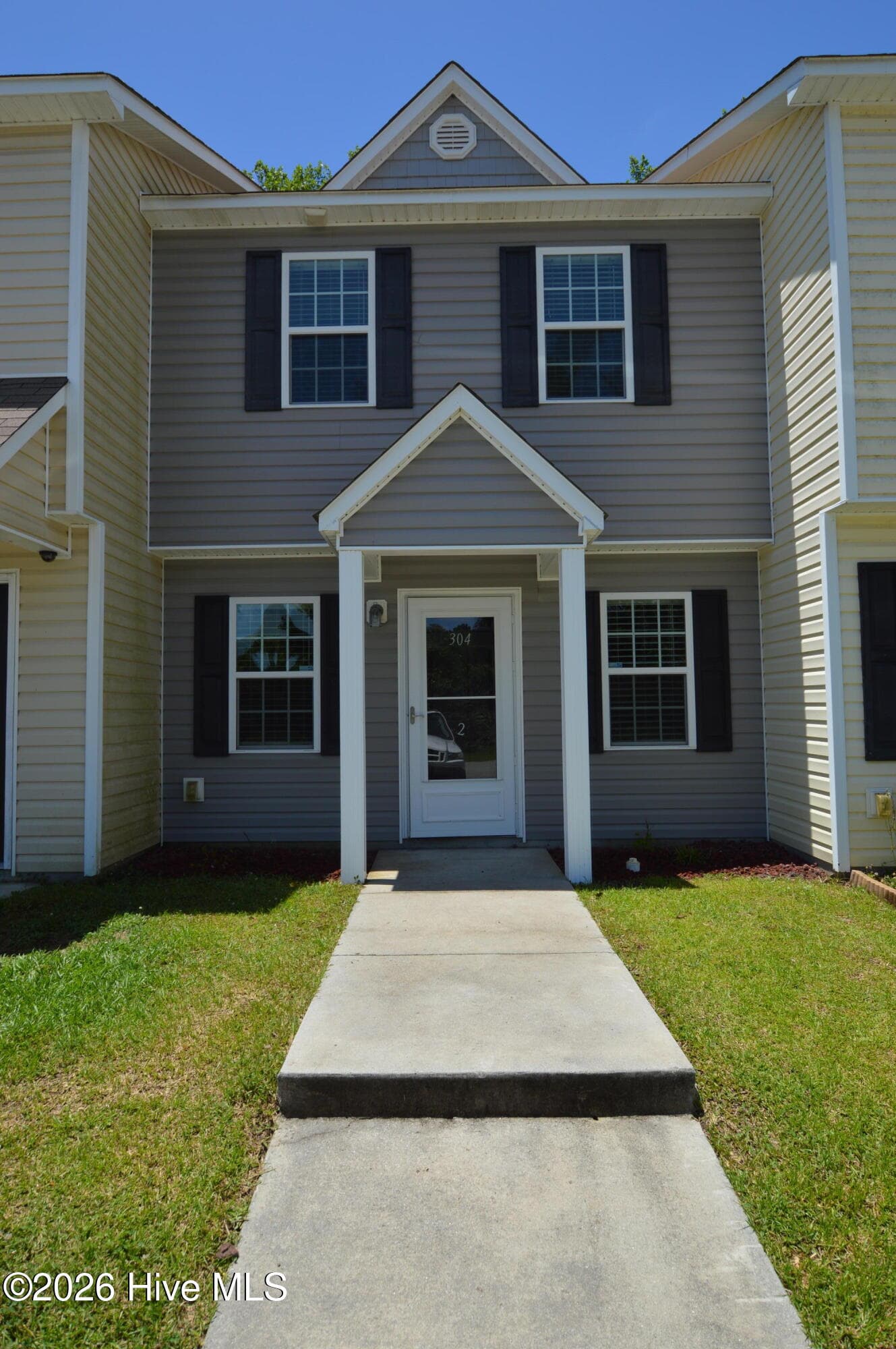 Front of 304 Burley Drive Unit 2, Hubert, NC 28539