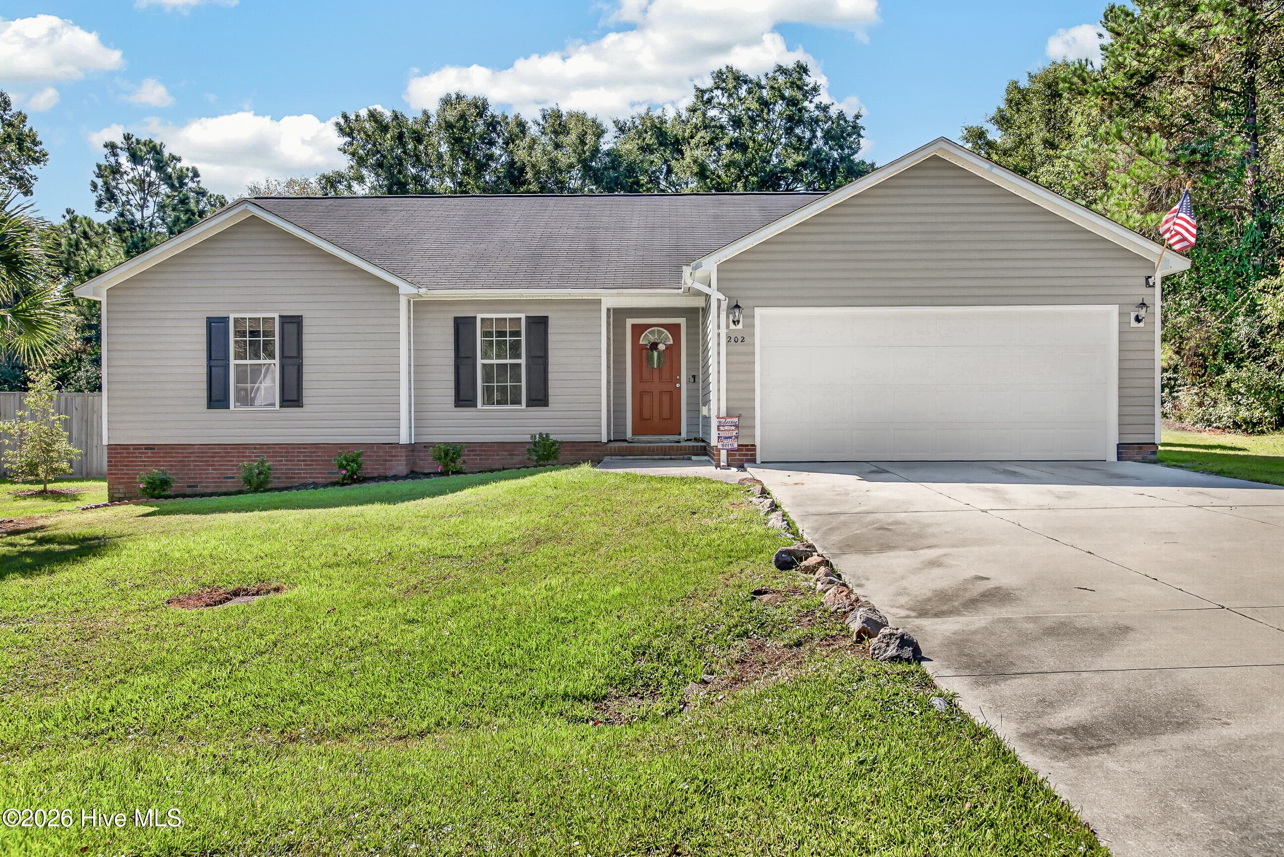 Front of 202 Hominy Court, Hubert, NC 28539