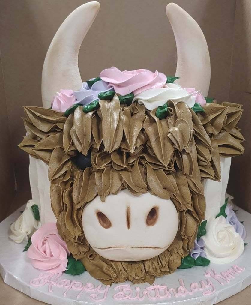 Custom highland cow specialty cake from Essential Sweets Bakery in Jacksonville NC