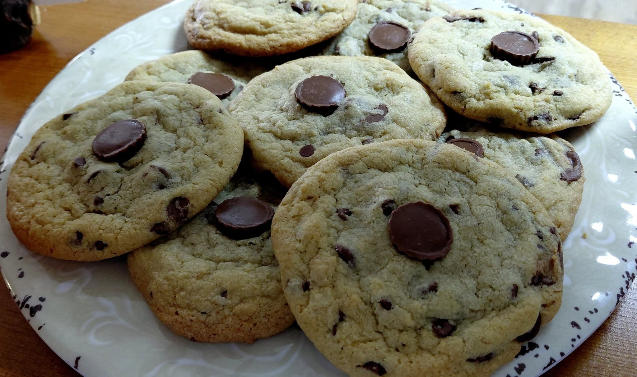 Chocolate chip cookies with a Reese’s peanut butter cup at Essential Sweets Bakery