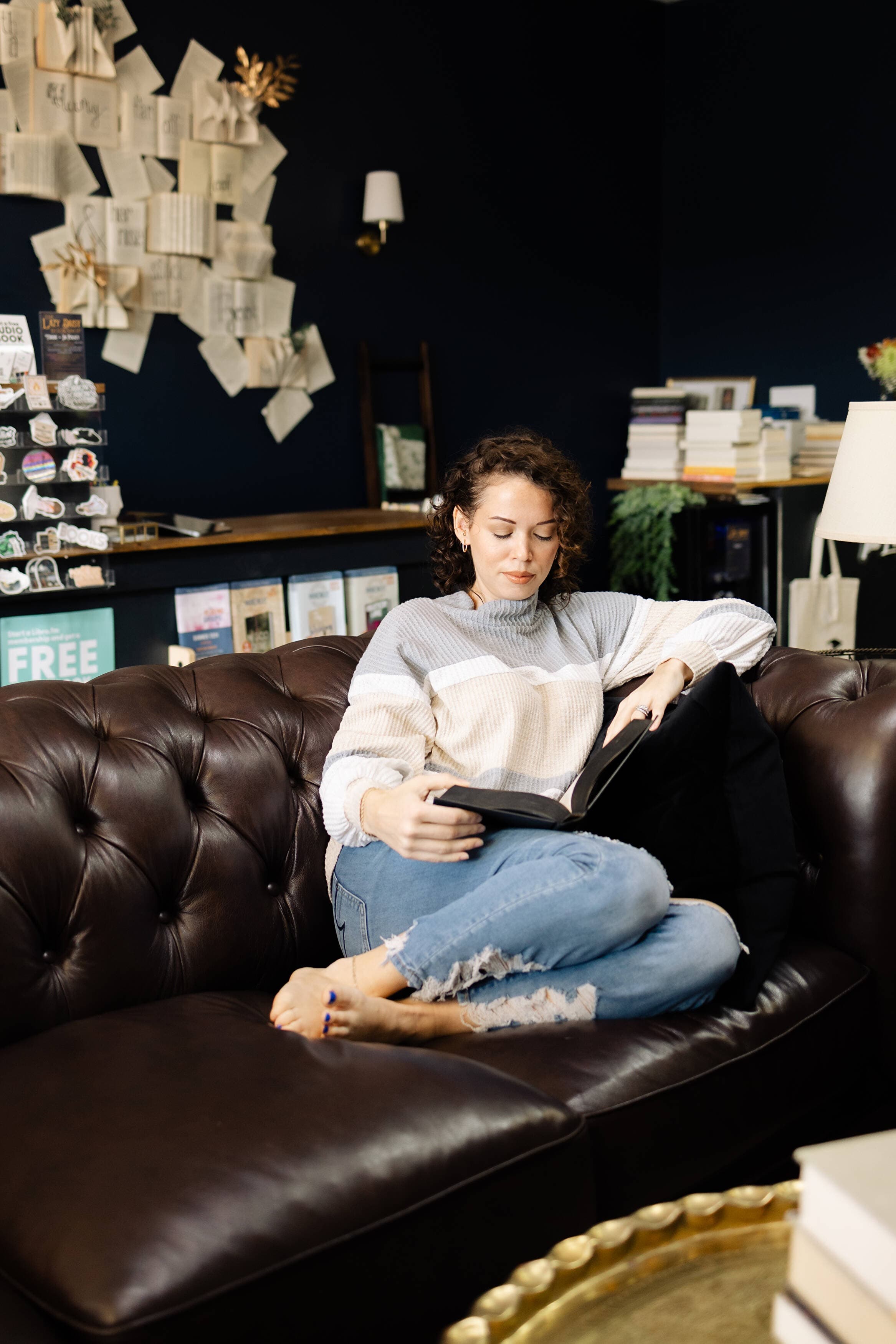 Woman reading a book in Jacksonville NC at The Lazy Daisy Bookshop