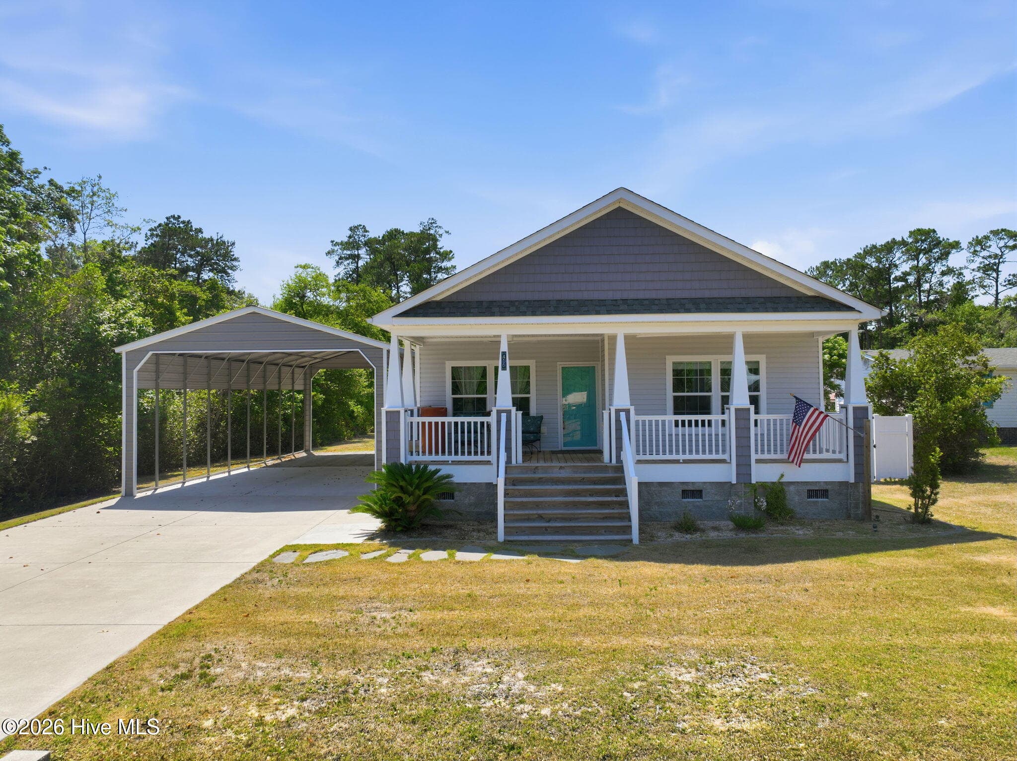 Front of 416 Ocean Spray Drive, Cedar Point, NC 28584
