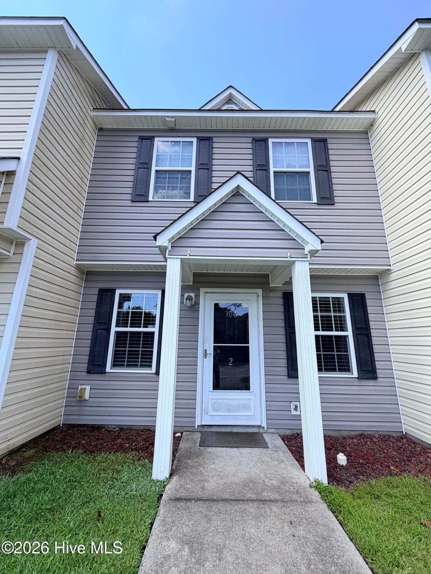 Front of 304 Burley Drive Unit 2, Hubert, NC 28539