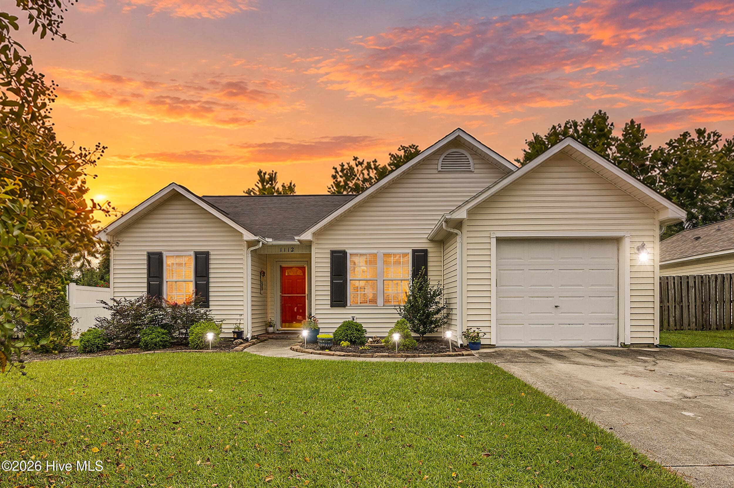 Front of 1112 Sunburst Way, Leland, NC 28451